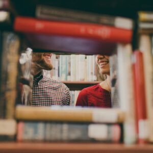 People talking in a library.
