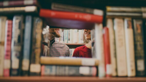 People talking in a library.